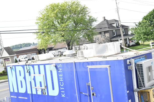 NBRHD Kitchens food trailer with dual Pitco gas fryers, CaptiveAire hood, Arctic Air refrigeration, and Daikin mini-split system.