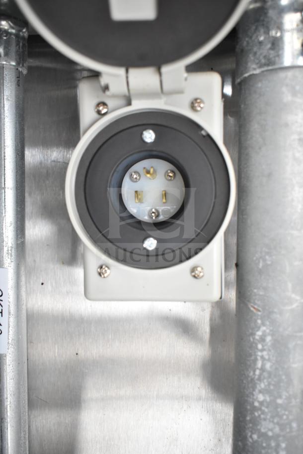 Power outlet on NBRHD Kitchens Ghost Kitchen Food Trailer, featuring robust connection for Pitco gas fryers and Arctic Air refrigeration.