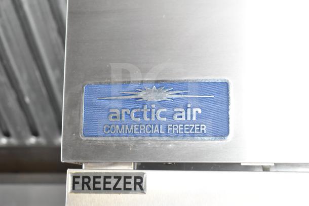 Arctic Air commercial freezer label on stainless steel surface, part of NBRHD Kitchens ghost kitchen food trailer equipment package.