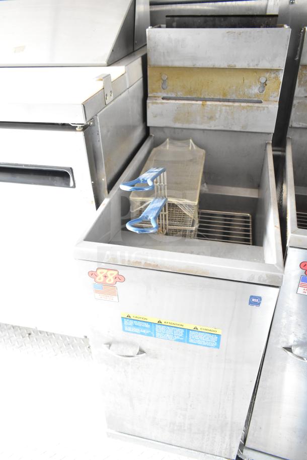 NBRHD Kitchens food trailer with dual Pitco gas fryers, CaptiveAire hood, and Arctic Air refrigeration, in used condition.