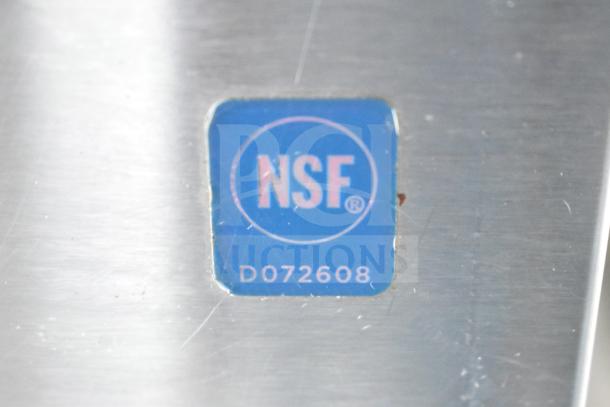 NSF certification label with the number D072608 on metal surface.