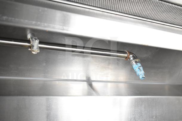 NBRHD Kitchens food trailer pipe detail, featuring stainless steel construction, indicative of durable interior setup.