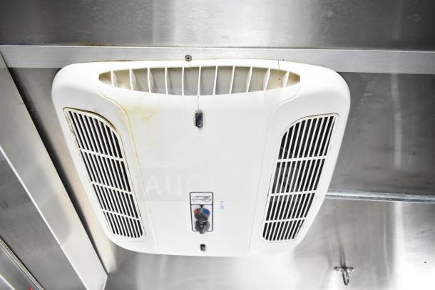 Daikin Mini-Split AC unit in NBRHD Kitchens food trailer, mounted on stainless steel interior, shown with air vents and controls.
