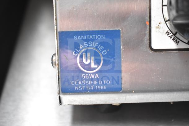 "UL Classified" sanitation label on the NBRHD Kitchens food trailer, model 56WA, NSF 14-1986 compliance.