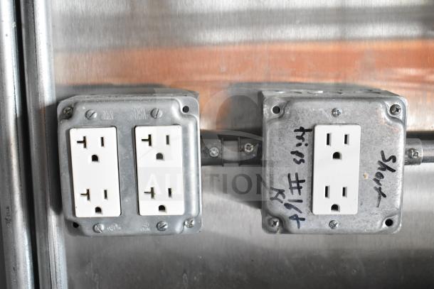 Electrical outlets inside the NBRHD Kitchens Ghost Kitchen Food Trailer, showing dual Pitco gas fryers and CaptiveAire hood system.