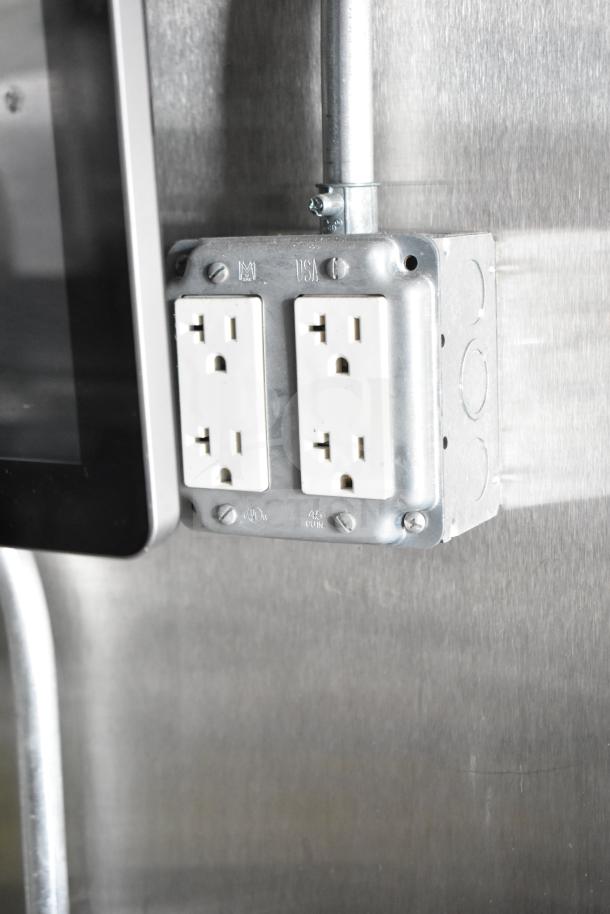 Electrical outlet in NBRHD Kitchens Ghost Kitchen Food Trailer. Features include dual Pitco gas fryers and Arctic Air refrigeration.