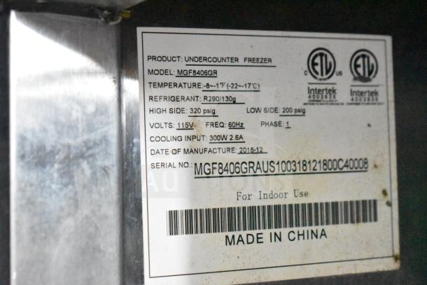 Label on NBRHD Kitchens Ghost Kitchen trailer mentions Arctic Air MGF8406GR model, temperature range, voltage, and manufacture date.