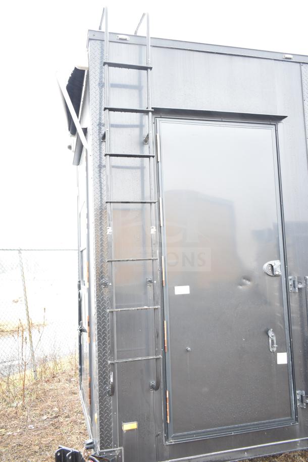 2020 Southern Dimensions Group 8.5' x 20' all-black mobile commissary trailer with ladder, visible side door, and tandem axle.