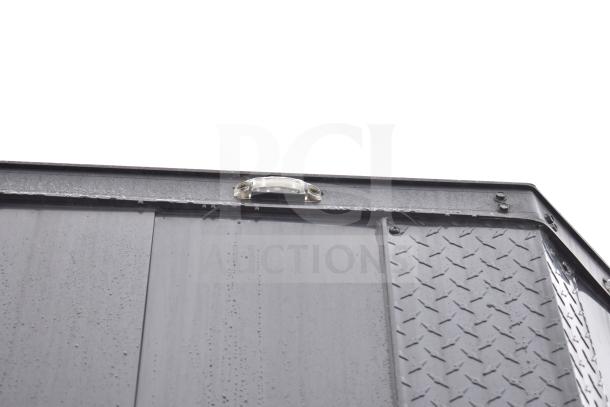 2020 Southern Dimensions Group 8.5' x 20' all-black mobile trailer corner detail, featuring light and diamond plate surface.