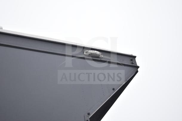 2020 Southern Dimensions 8.5' x 20' black mobile trailer, tandem axle, close-up of exterior corner detail.