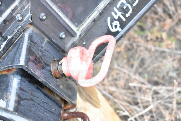 Close-up of a red tow hook on a black 2020 Southern Dimensions Group trailer. Surface shows signs of wear. VIN partially visible.