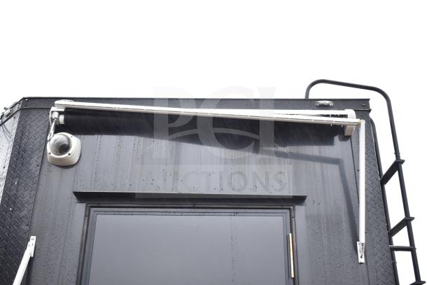 2020 Southern Dimensions 8.5' x 20' all-black mobile commissary trailer, exterior view with security camera.