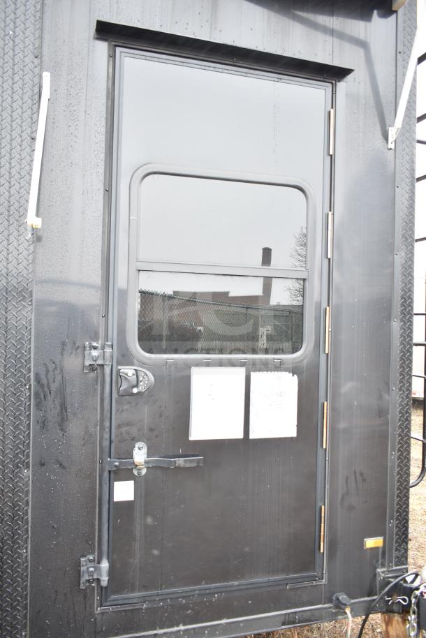 2020 Southern Dimensions Group 8.5' x 20' all-black mobile trailer with tandem axle, showing rear door. Equipped for commissary use.