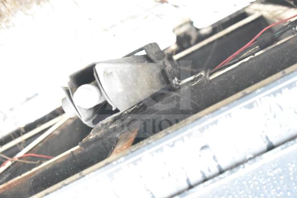 Close-up of the undercarriage of a 2020 Southern Dimensions Group mobile trailer, showing wiring and structural components.