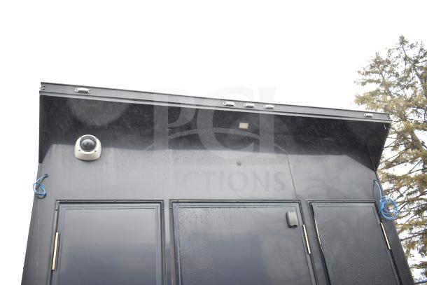 2020 Southern Dimensions Group all-black mobile commissary trailer exterior with security camera and doors visible.