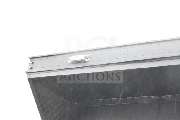 Close-up of 2020 Southern Dimensions Group trailer's top edge, showing metal construction and part of its structural design.