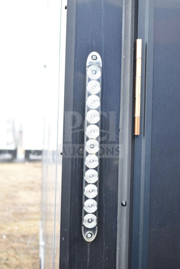 All-black exterior of the 2020 Southern Dimensions Group mobile commissary trailer, showing LED light strip detail.