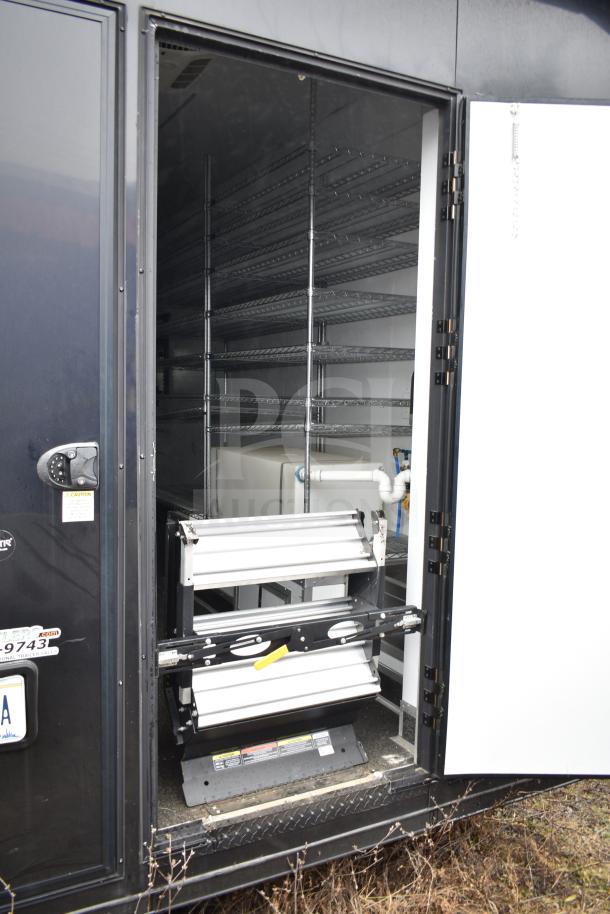 2020 Southern Dimensions 8.5' x 20' black mobile commissary trailer with shelving, AC, sinks, and water heater visible.