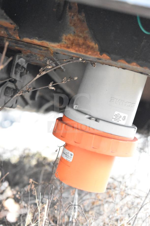 Underneath view of the Southern Dimensions 8.5' x 20' trailer showing an orange and gray utility connection.