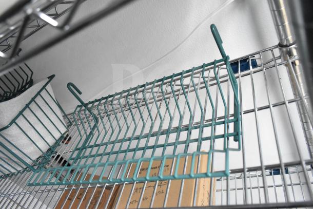 Wire shelving inside 2020 Southern Dimensions Group Mobile Commissary Trailer, includes IT/Network cabinet and storage space.