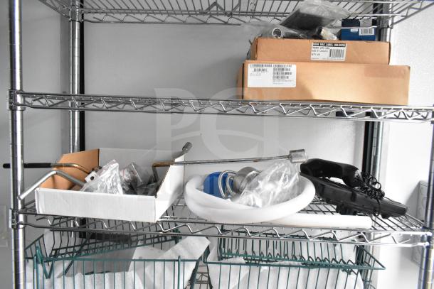Wire shelving within the 2020 Southern Dimensions Group mobile trailer, featuring stored boxes and miscellaneous parts.