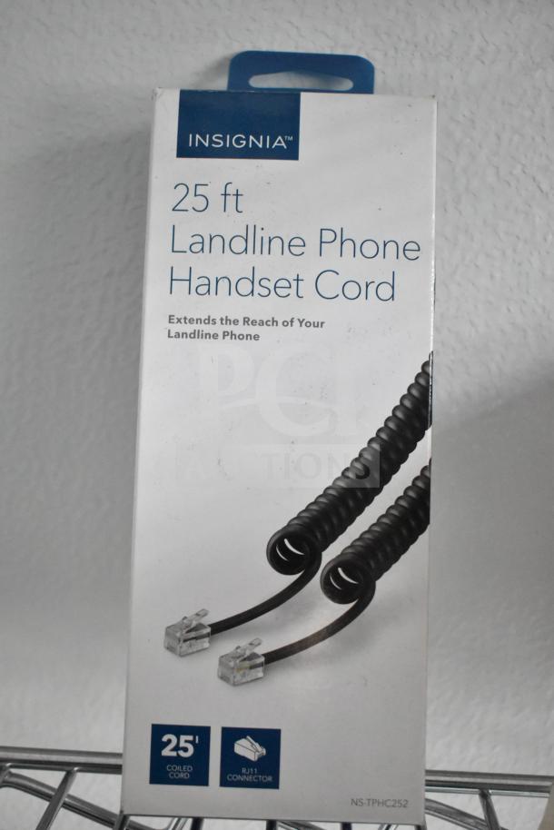 "Insignia 25 ft black landline phone handset cord in box, features coiled design and RJ11 connector for extended reach."