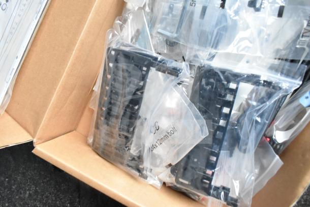 A box containing various electronics components in plastic bags, labeled "5M Bolt 4x12mm."
