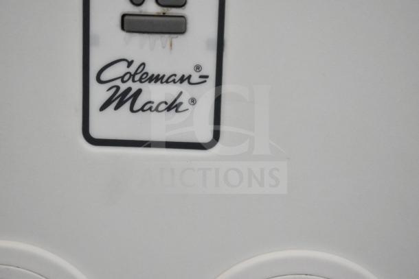 Coleman Mach logo on white panel of 2020 Southern Dimensions Group mobile commissary trailer.