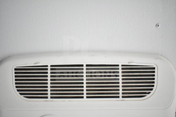 Interior view of a 2020 Southern Dimensions Group trailer showing the Coleman Mach AC vent, part of the mobile commissary features.