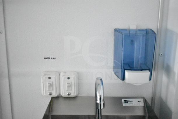 Interior of 2020 Southern Dimensions Group mobile trailer showing a dual John Boos sink, water pump switch, and soap dispenser.