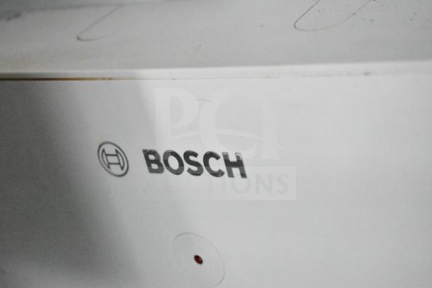 Close-up of a Bosch logo on a water heater in a 2020 Southern Dimensions Group mobile commissary trailer.