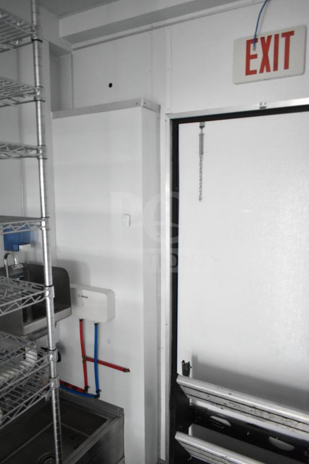 2020 Southern Dimensions 8.5' x 20' mobile trailer interior with Bosch water heater, dual sinks, and wire shelving.