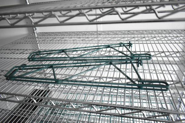 Metal wire shelving in a 2020 Southern Dimensions Group trailer, included with IT/network cabinet.