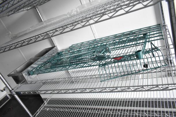 Interior of 2020 Southern Dimensions Group 8.5' x 20' mobile trailer, featuring wire shelving and dual John Boos sinks.