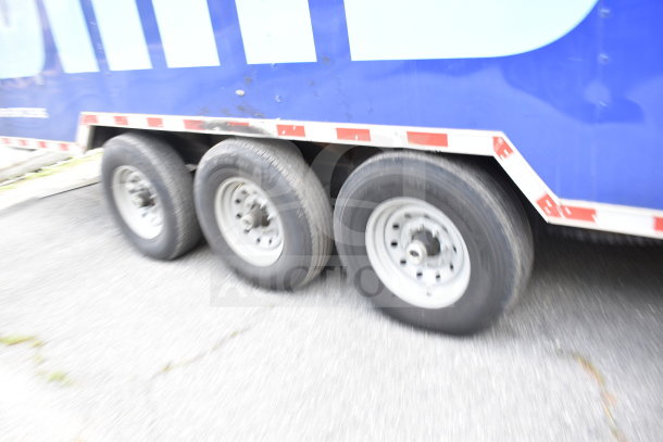 2021 Rock Solid Cargo 28ft food trailer exterior view, triple axle, good condition, blue color, auction item.