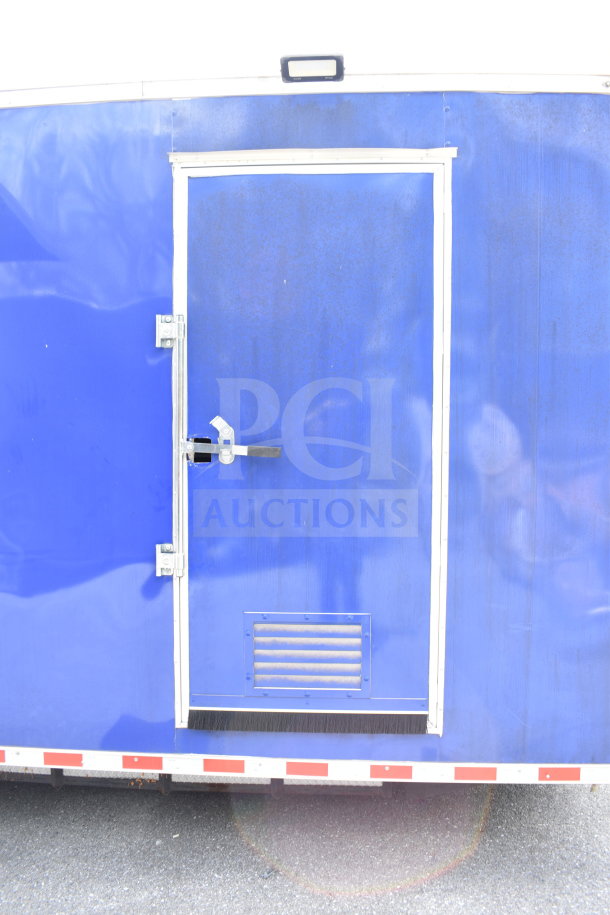 Blue 2021 Rock Solid Cargo 28ft food trailer with door and vent, featuring CaptiveAire hood and Nieco charbroiler.