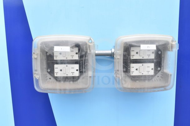 Exterior view of electrical outlets on a 2021 Rock Solid Cargo food trailer. Intermatic covers used, labels 1 and 45 visible.
