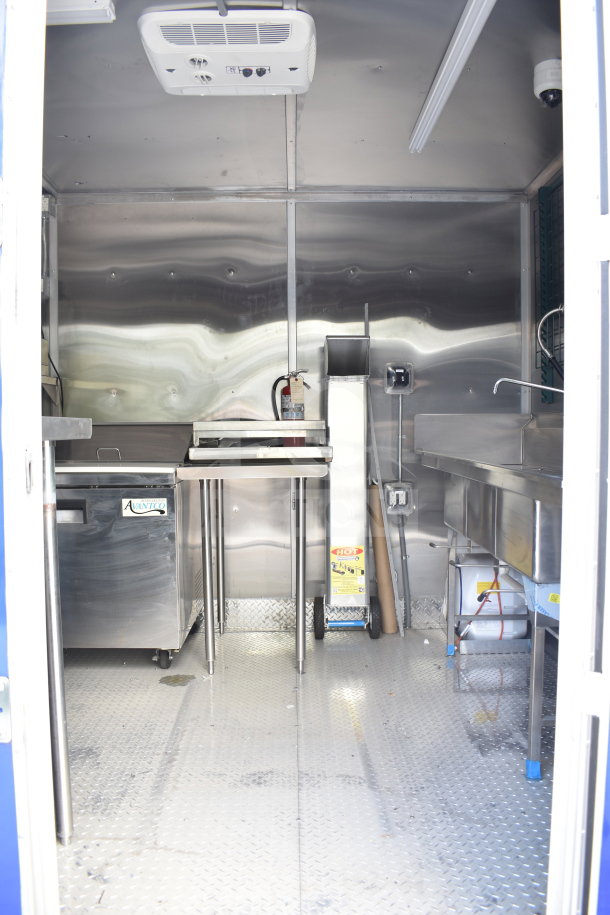 New 2021 Rock Solid Cargo 28ft food trailer, includes CaptiveAire hood, refrigeration, Nieco charbroiler. Clean interior.