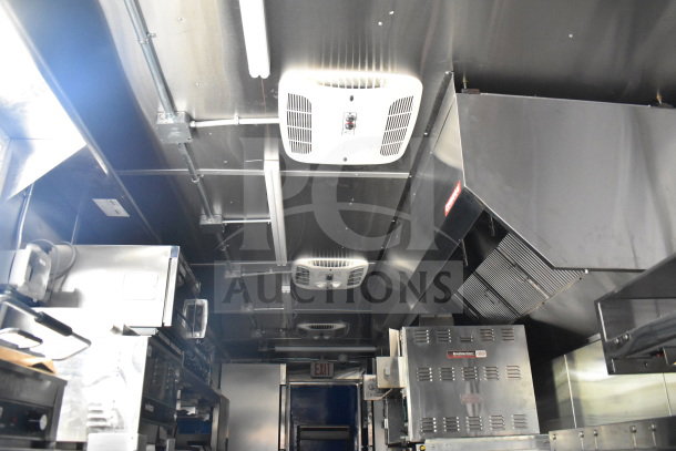 New 2021 Rock Solid Cargo 28ft food trailer interior with CaptiveAire hood, refrigeration, Nieco charbroiler. VIN: 7H2BE2837ND041749.