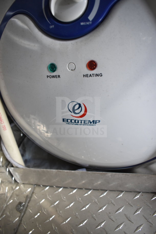 ECCOTEMP water heater in a Rock Solid Cargo 28ft food trailer. Features power and heating indicators.