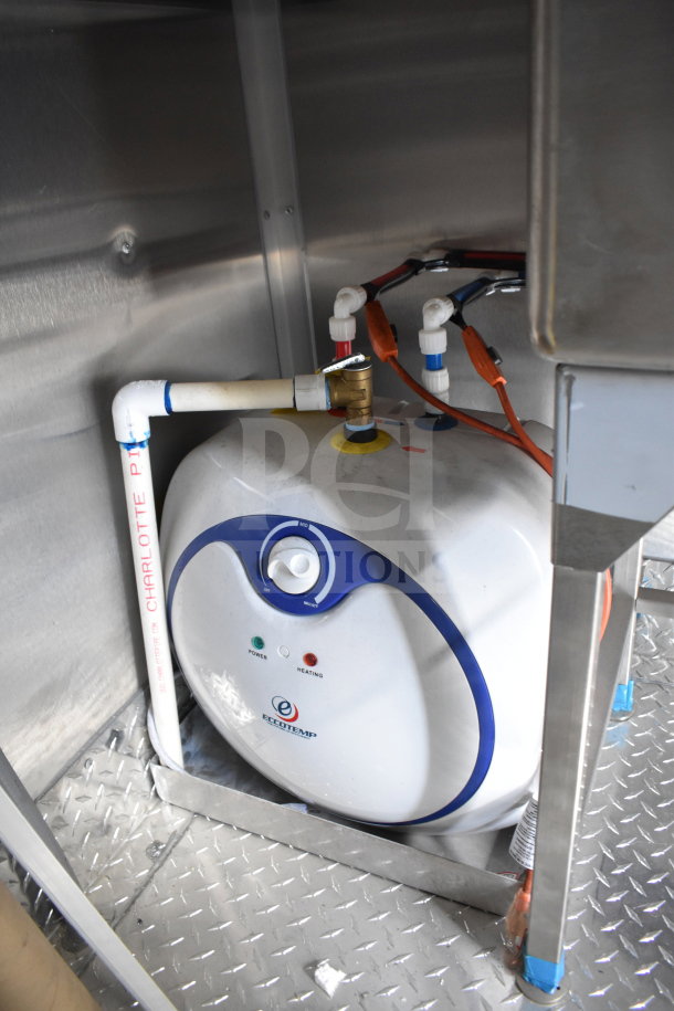 2021 Rock Solid Cargo food trailer interior featuring Eccotemp water heater with piping and connections visible.