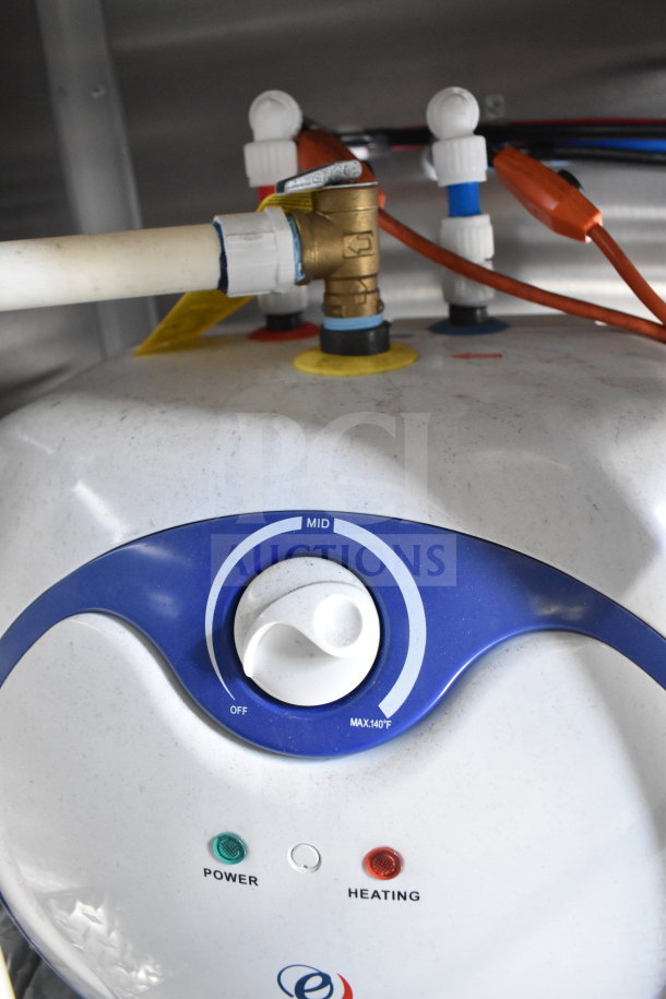 Control panel of the 2021 Rock Solid Cargo food trailer's water heating system, showing power and heating indicators.
