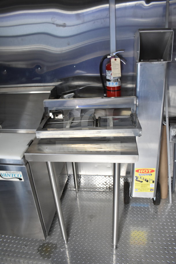 2021 Rock Solid Cargo 28ft food trailer interior, featuring CaptiveAire hood, Vanco refrigeration, and Nieco charbroiler.