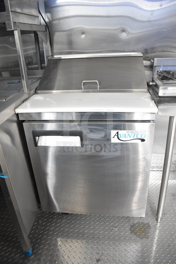 Stainless steel Avantco refrigerator in new condition inside Rock Solid Cargo 28ft food trailer.