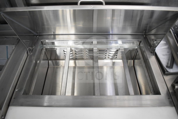 New 2021 Rock Solid Cargo 28ft food trailer interior; stainless steel compartment with CaptiveAire hood system.