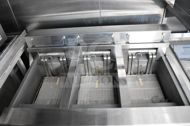 Stainless steel commercial fryers inside a 2021 Rock Solid Cargo 28ft food trailer, equipped with high-quality cooking systems.