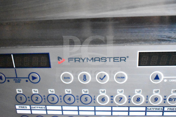Control panel of Frymaster equipment, featuring buttons for cooling, filtering, and various settings. Located in a Rock Solid Cargo food trailer.