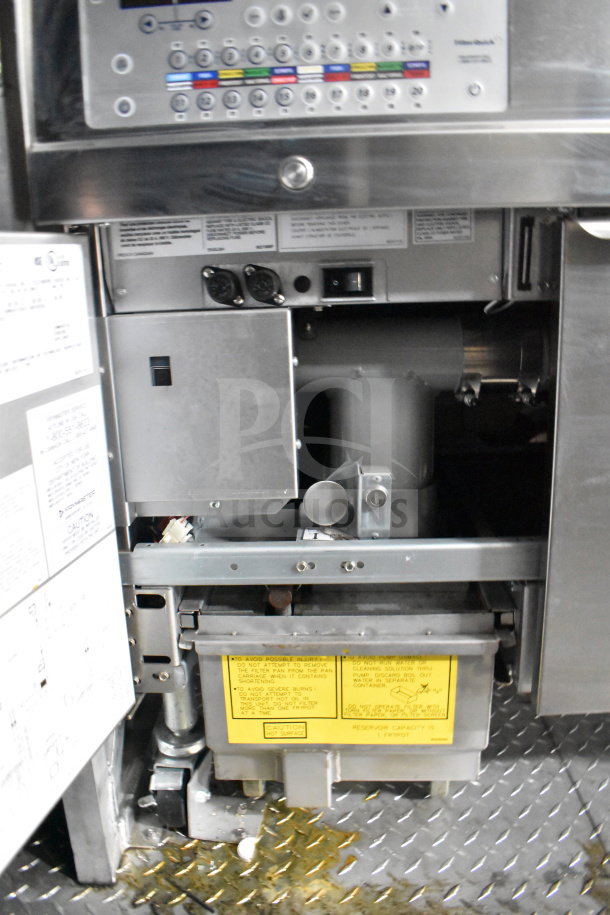 Alt text: Interior of 2021 Rock Solid Cargo food trailer featuring control panel, ventilation, and equipment. Labels indicate safety info.