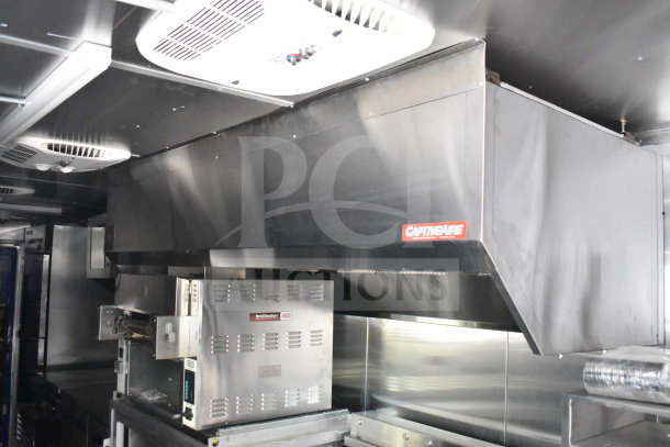 New 2021 Rock Solid Cargo 28ft food trailer with CaptiveAire hood system and Nieco Charbroiler, in pristine condition.