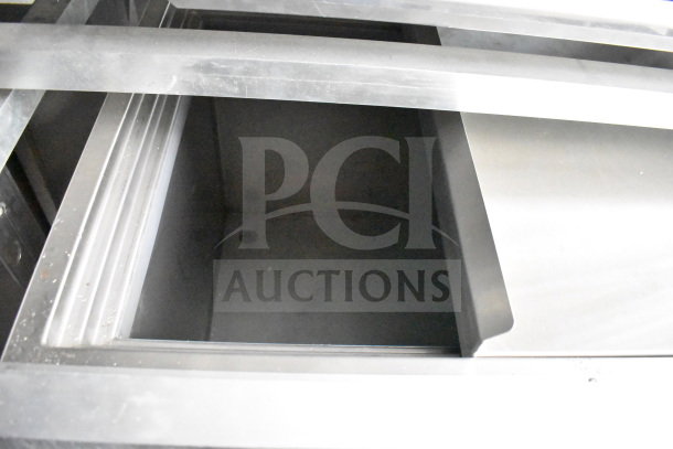 Interior view of a 2021 Rock Solid Cargo 28ft food trailer showing stainless steel structure.